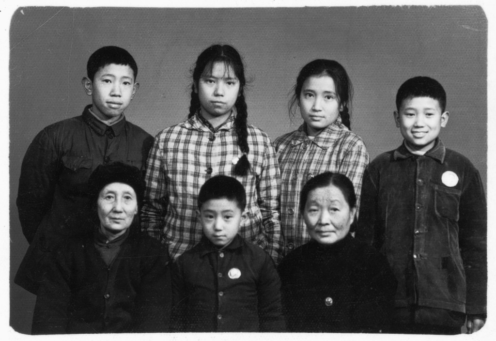 On the eve of being expelled to the edge of the Himalayas (standing second from right); with (standing from left): Jin-ming, Xiao-hong, and Xiao-hei; front row (from left): my grandmother, Xiao-fang, and Aunt Jun-ying; Chengdu, January 1969.  The last photograph of my grandmother.