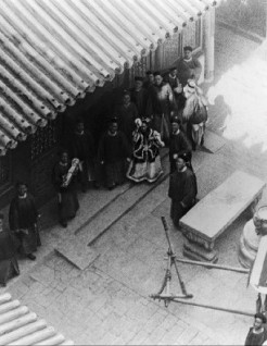Cixi returned to Beijing at the beginning of 1902, travelling the last leg by train, with the imperial locomotive provided by the Allies.   A foreigner on the city wall sanpped a picture of her as she turned to wave at them, a handkerchief in hand.
