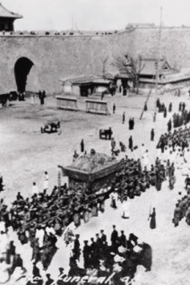 Cixi's funeral.  Brooke Astor, American philanthropist, was a child in Beijing and watched the procession with her family from the city wall: 'All day it passed beneath us through the gate.  There were Buddhit and Taoist priests in white robes and Buddhist lamas in yellow with red sashes.  There were endless bands of eunuchs dressed in white, who tossed paper money in the air (for the Empress's use on her way to heaven)...There were twenty-four white camels, with yellow brocade tents on their backs...and a whole company of white ponies...there were papier-mache replicas of  all the Empress's palaces ...All this passed accompanied by the cries of the mourners, who tore their hair and beat their chests to the clashing of cymbals.'  The colossal palanquin was covered with yellow brocade embroidered with phoenixes.  When it passed by, all Westerners rose and took off their hats.