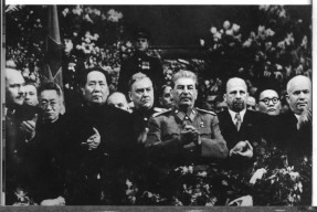 Looking grim, next to his patron and rival, Stalin, at the ceremony for Stalin's seventieth birthday, Moscow, December 1949.  To Stalin's left is East Germany's leader Walter Ulbricht, to whom Mao suggested buiding a wall; Mongolia's Tsedenbal far right; Soviet Marshal Bulganin in the centre (rear).  Behind Mao's right shoulder is his interpreter Shia Zhe, who provided us with much valuable information about Mao's relationship with Stalin.