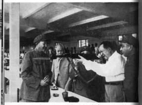 "Power comes out of the barrel of the gun".  Mao at a military exercise, with (from left) Luo Ruiqing and President Liu Shao-ch'i.