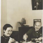 The Chiangs eating under his portrait, early 1940s.